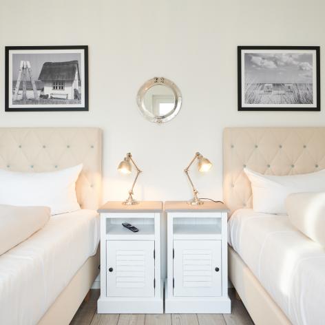 Foto einer Ferienwohnung, die Betten im Schlafzimmer